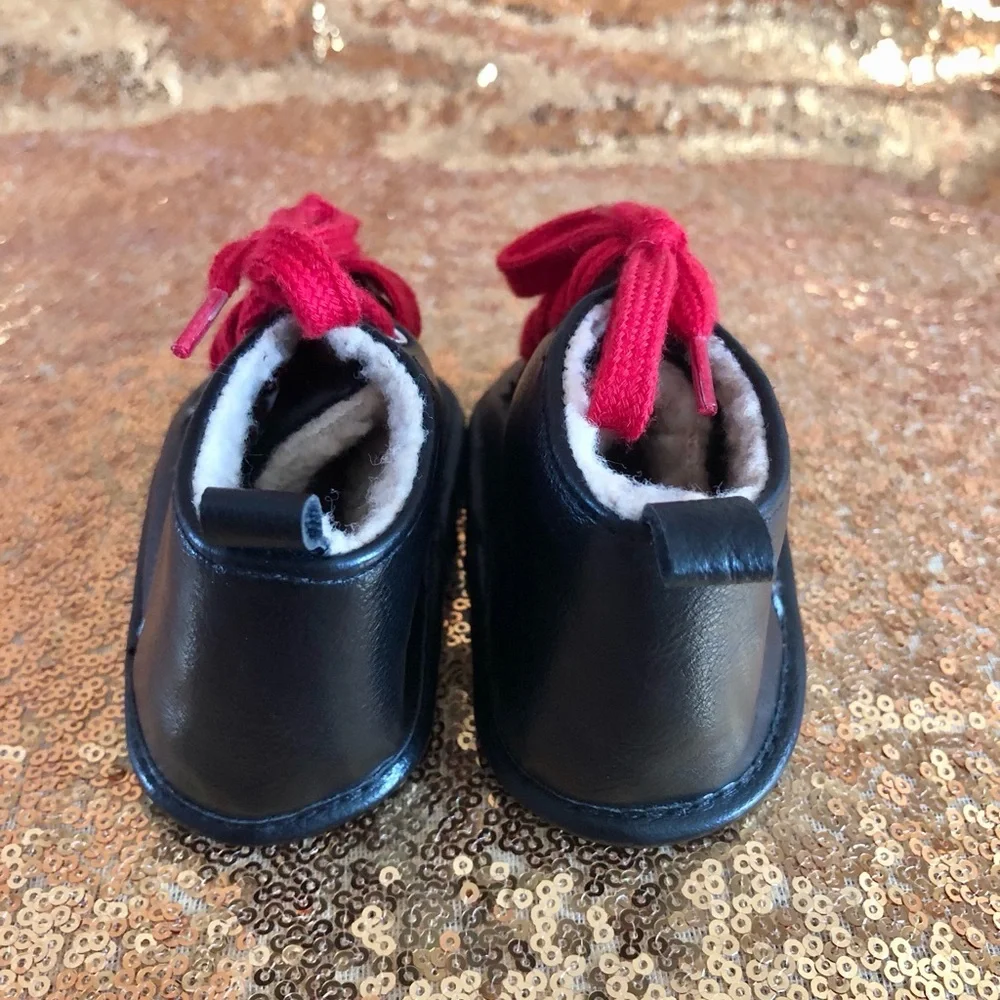 Fila-Black w/sherpa infant boots w/red laces 9-12 months old. Booties shoes